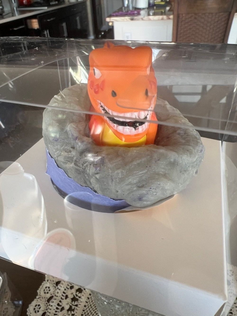 Hand Crafted Orange Dinosaur Bath Toy in Gray Nest